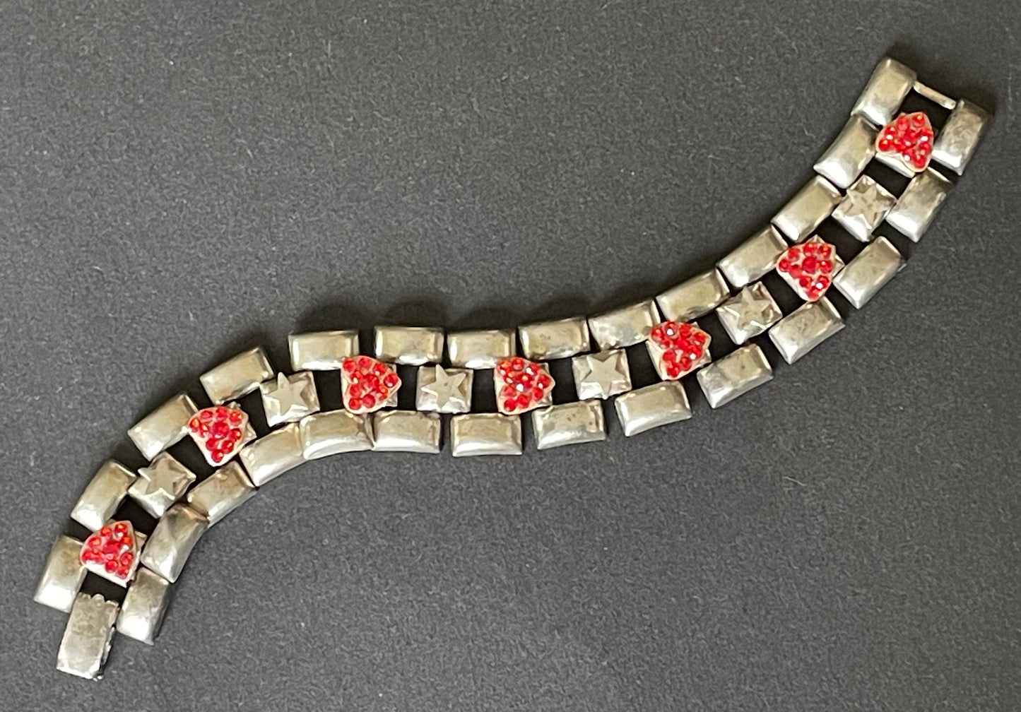 Vintage signed Askew London red rhinestone heart and star tank track panel bracelet in antique silver tone