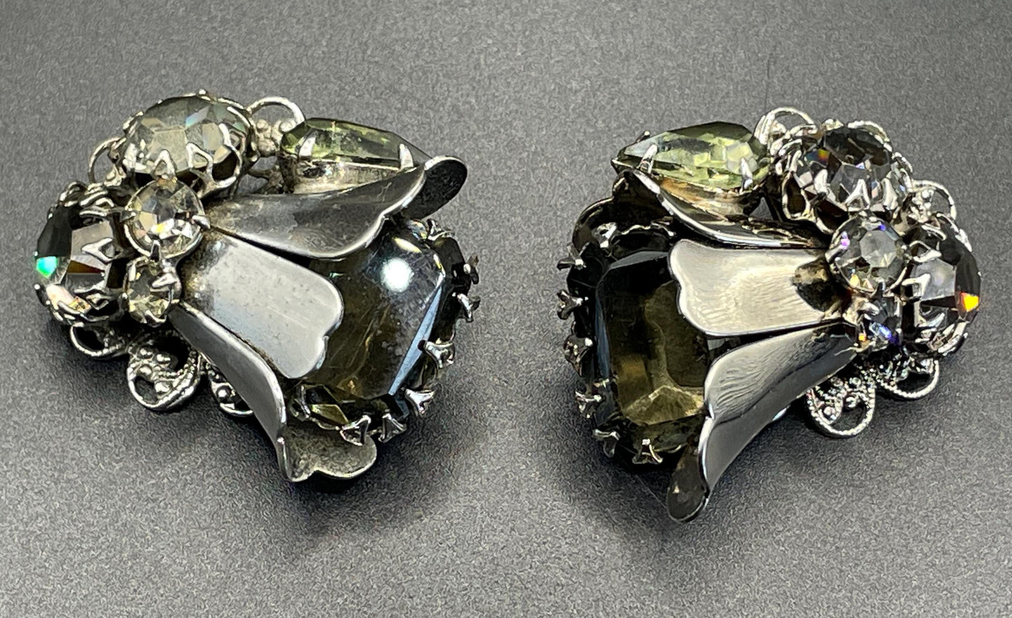 Vintage large rhinestone tulip flower design clip on earrings, silver tone with grey / green rhinestones and filigree backs