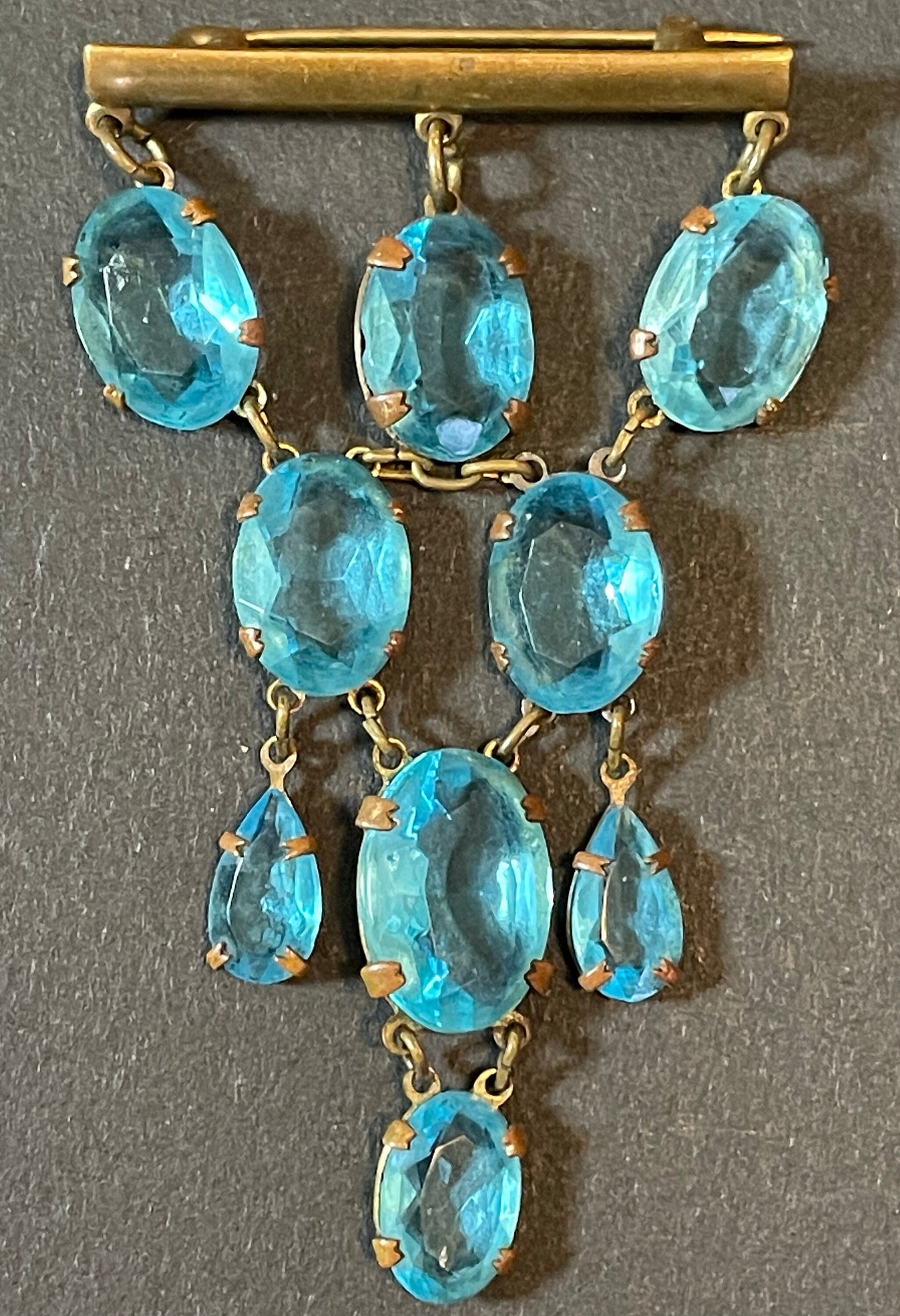 Vintage Art Deco aqua blue paste festoon dangle brooch with bezel set, open backed aquamarine coloured crystals set in antique gold tone