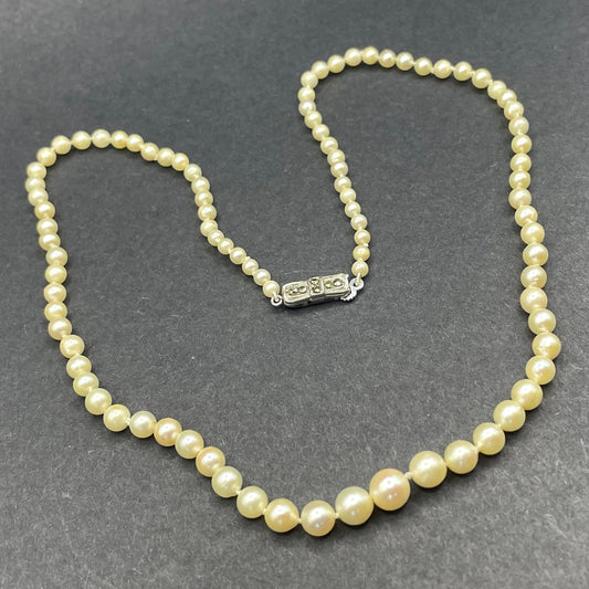 Vintage real cultured pearl necklace, graduated in size, hand-knotted, pretty silver tone and marcasite fish hook clasp