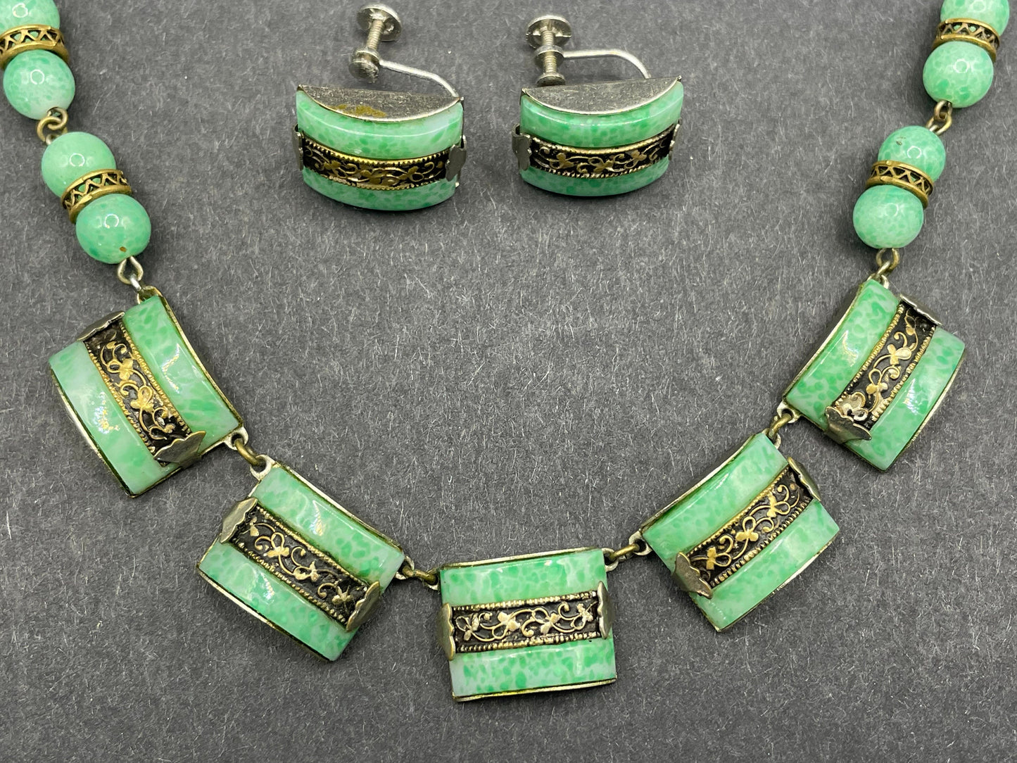 Vintage Art Deco machine age chrome silver tone and brass gold tone, green 'Peking' style glass necklace and screw back earrings set