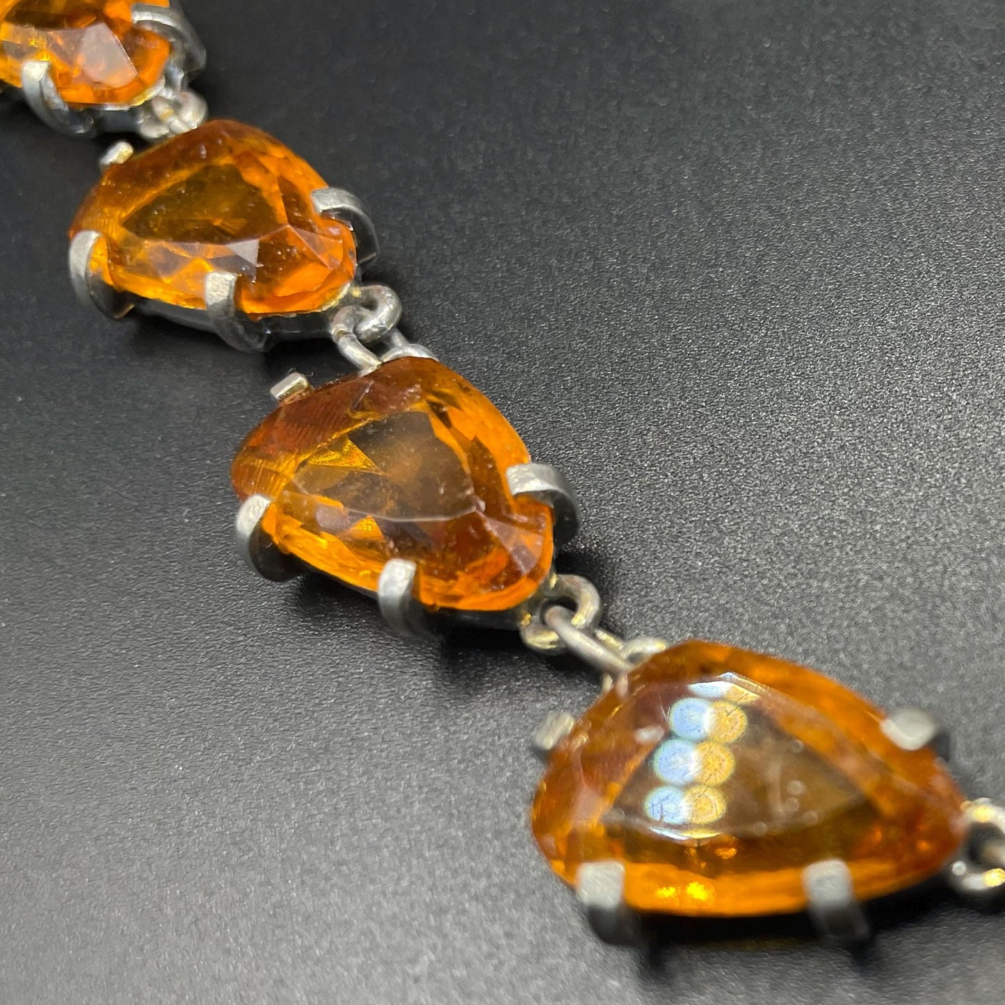 Vintage signed Sphinx citrine yellow / topaz orange glass riviere necklace, triangle shaped crystals set open-backed in silver tone settings