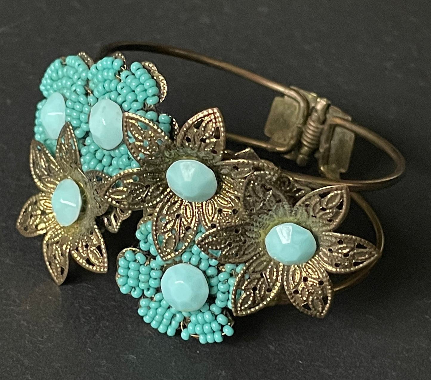 Vintage early Miriam Haskell turquoise blue glass beaded floral clamper bangle with intricate micro beading and gold tone filigree