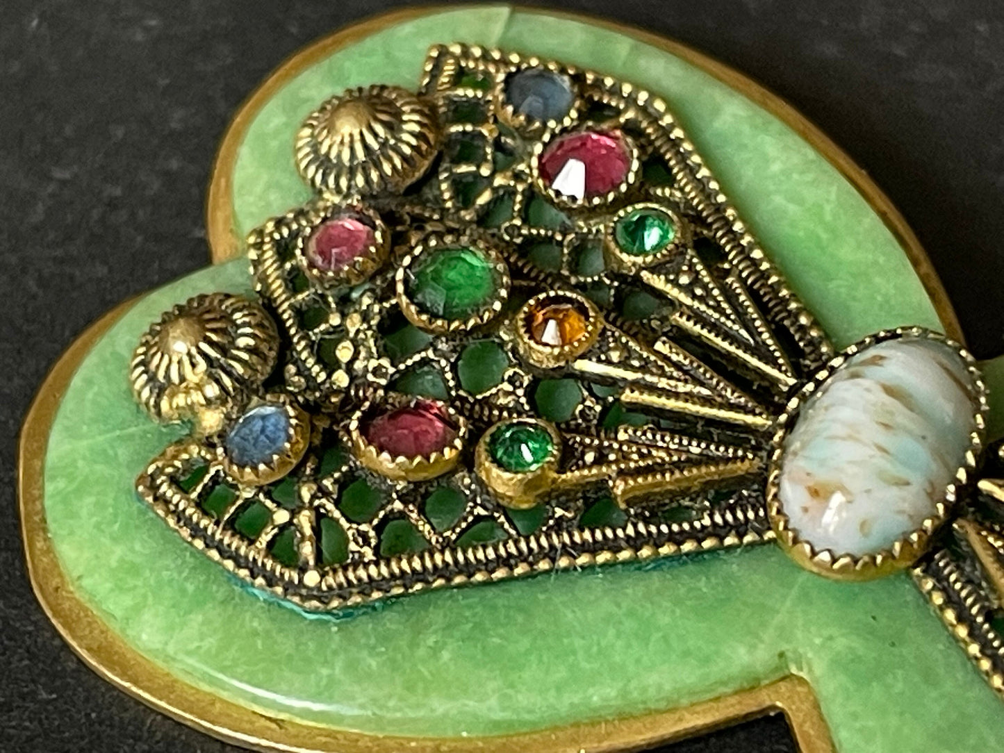 Vintage Art Deco bow shaped brooch, green galalith, gold tone with filigree and multi-coloured rhinestones Max Neiger brothers style