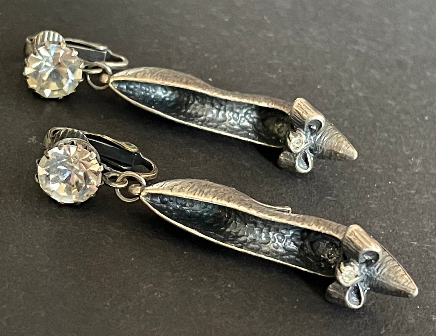 Vintage early Askew London stiletto high heeled shoe statement clip on earrings in chic dark silver tone with clear rhinestones