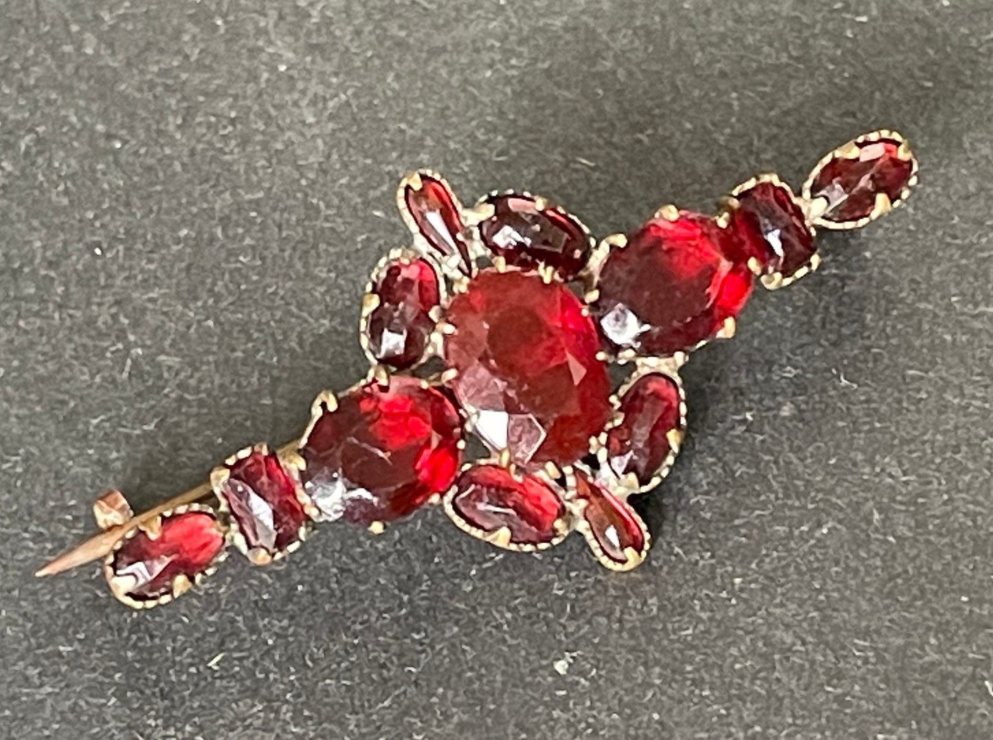 Vintage / antique Bohemian garnet brooch, different shaped stones set in gold tone, early Art Deco period 1920s