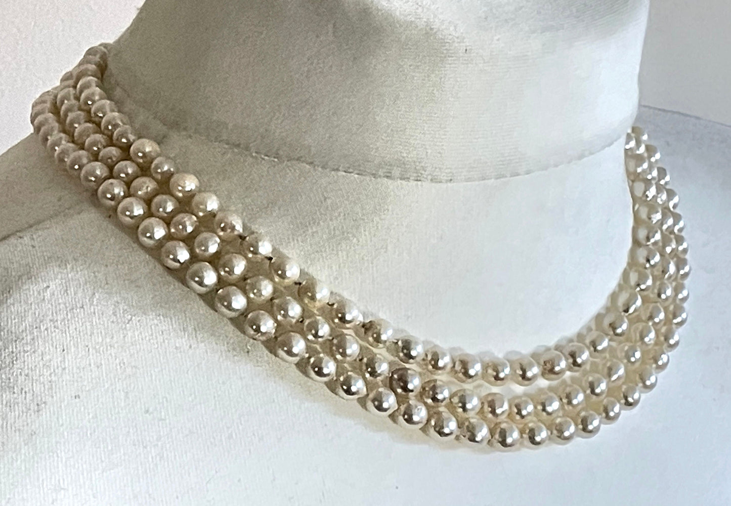 Antique / vintage real cultured pearl triple strand necklace, hand-knotted, in box, pretty silver with emerald green & clear paste box clasp